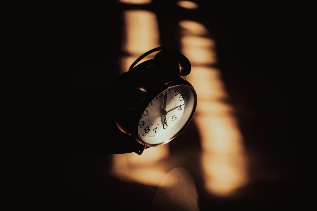 old style alarm clock in a dark room